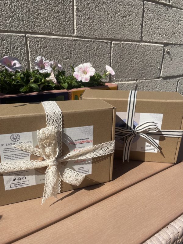 Two Balance Box Smudge Kits in Front of Wall Next to Flower Box - Sit, Breathe, Balance.