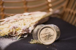 Mugwort and lavender in jar spilling out next to dried flower bouquet - Sit, Breathe, Balance