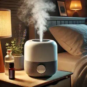 Humidifier by bedside table emitting gentle mist of eucalyptus essential oil - Sit, Breathe, Balance.